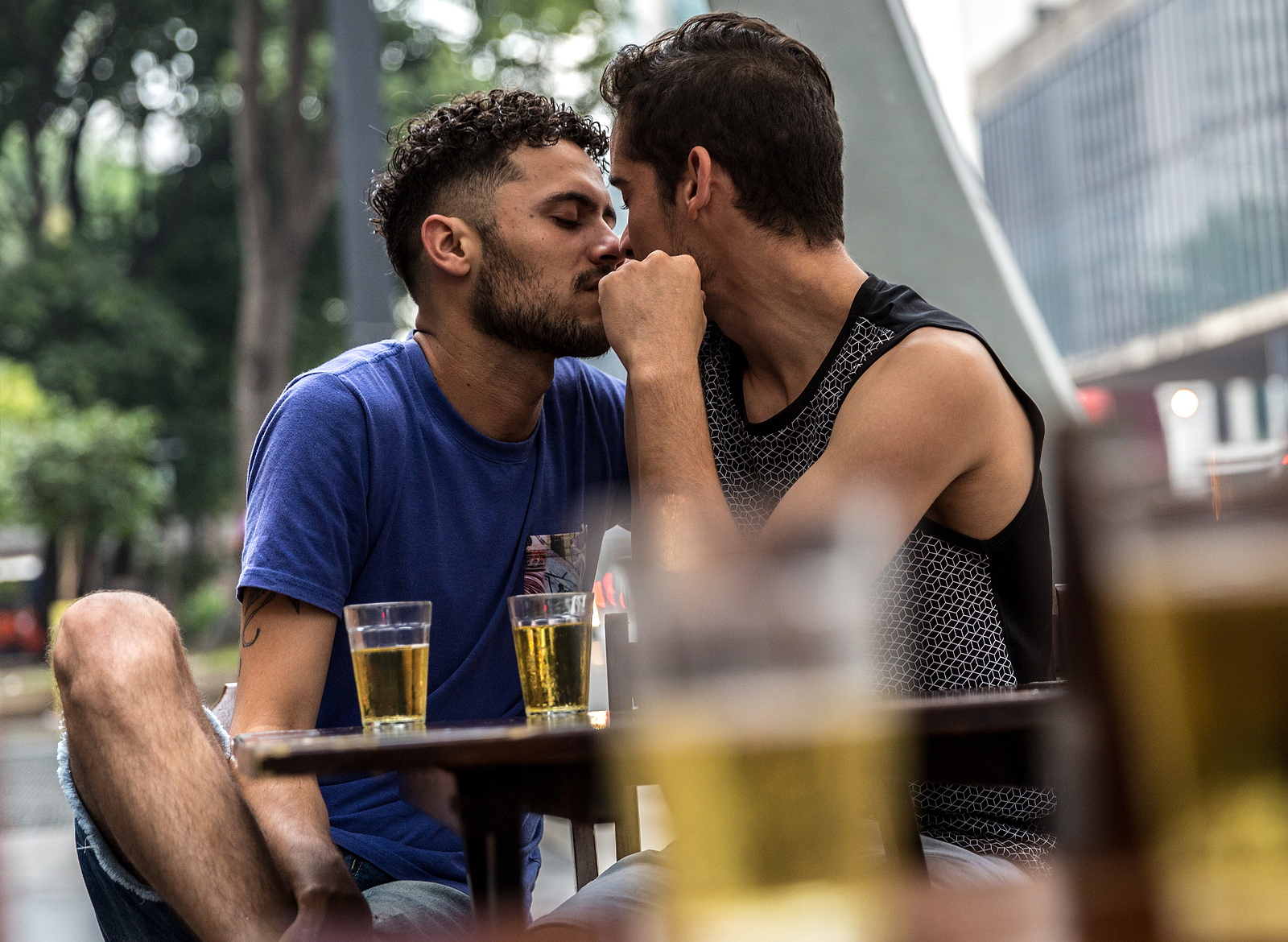 Gay couple drinking beer