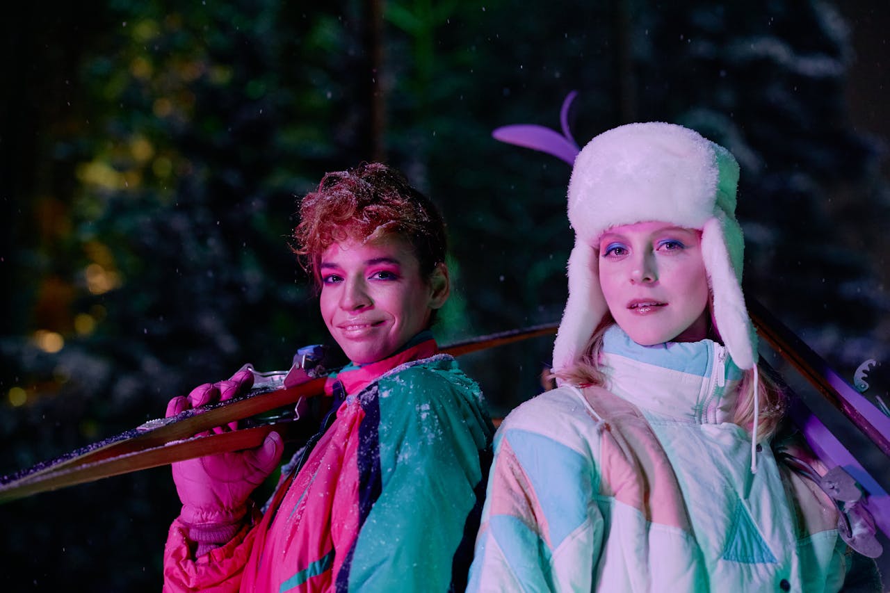 women holding skis