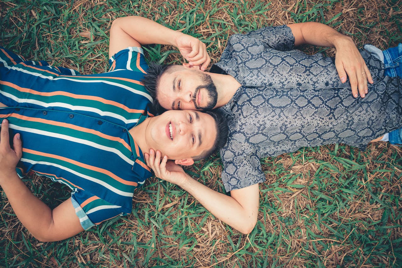 couple lying on grass